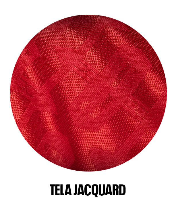Tela jacquard roja Xolos-Reebok con dise&ntilde;o sutil. Ideal para jugar con estilo y comodidad.
