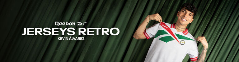Banner secci&oacute;n mobile Reebok Jerseys Retro con Oswaldo S&aacute;nchez en jersey negro con detalles verdes, brazos cruzados, fondo cortina verde.