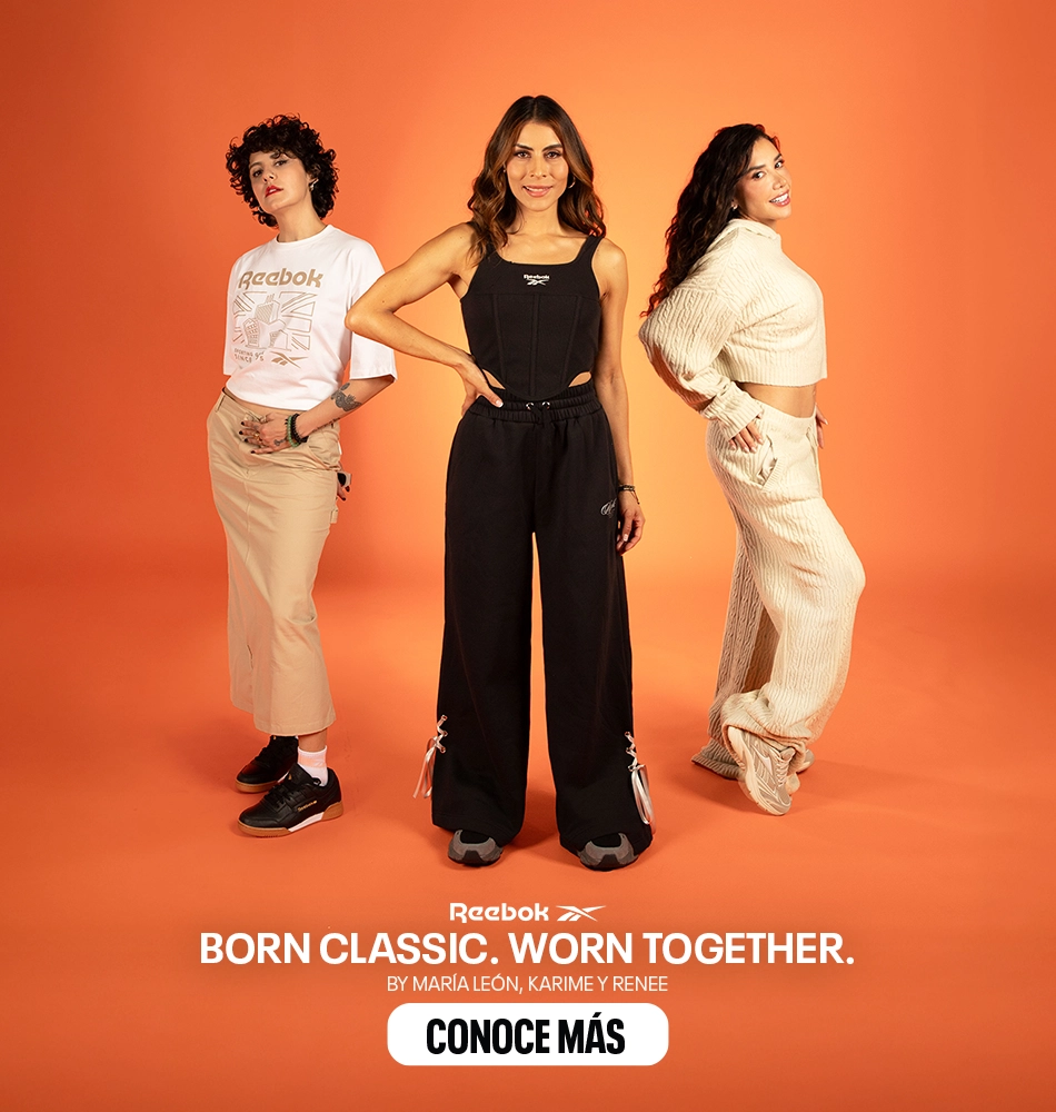 Karol G con outfit blanco y tenis Reebok en campa&ntilde;a sobre fondo naranja