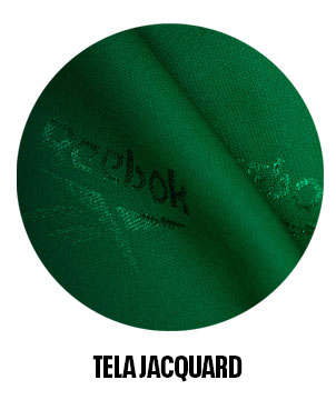Detalle tela jacquard verde con repetici&oacute;n del logo Reebok.
